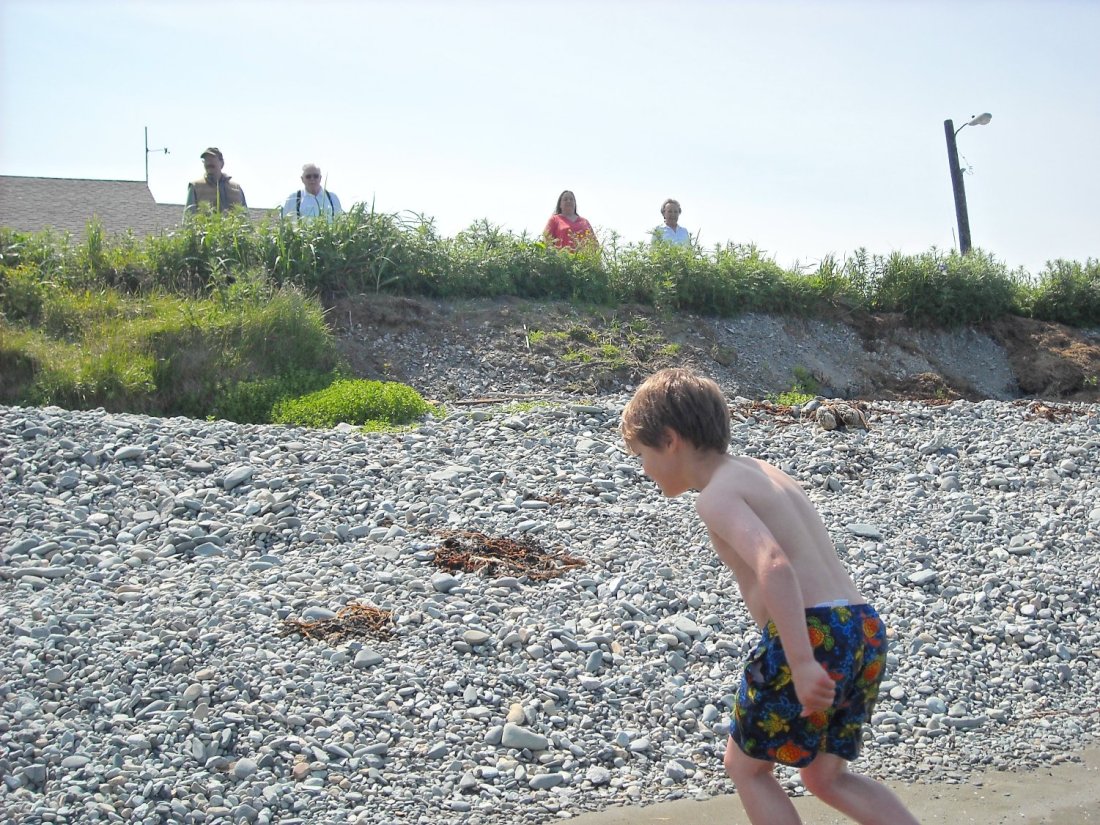 Dad, second from left, and Diane, next to Dad, are joined by Caleb and Mom as they watched SP on the front beach this summer.
